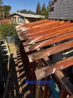 Pressure-treated wood deck framing with parallel joists and support beams under construction