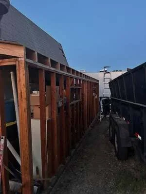 Commercial building framing with wooden structural components and construction staging